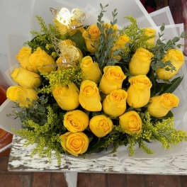 Bouquet of yellow roses with greenery and butterfly picks