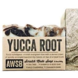 Yucca Root bar soap with a kraft paper label and marbled brown and cream top.