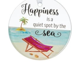 Round hanging ornament with beach chair art and the words 'Happiness is a quiet spot by the sea'.