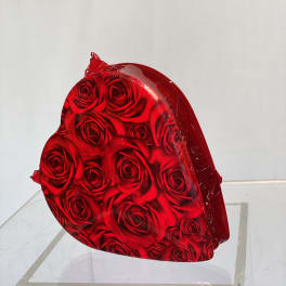 Heart-shaped box filled with red roses