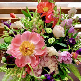 Colorful mixed bouquet with large pink blooms and purple flowers
