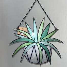 Hanging stained-glass-style wall art shaped like a potted plant