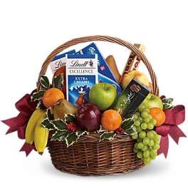 Fruit basket with chocolates and a ribbon