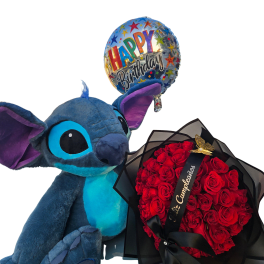 Gift set with blue plush toy, round red rose bouquet in black wrap, and a colorful Happy Birthday balloon.