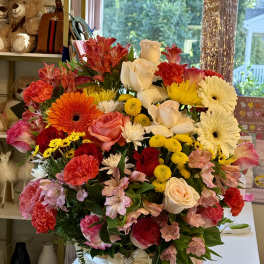 Large mixed flower basket with roses, gerbera daisies, and carnations