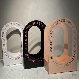 Three arched gift boxes with "Just For You" text in white, black, and blush.