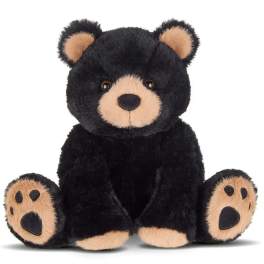 Black teddy bear plush with tan muzzle and paw pads
