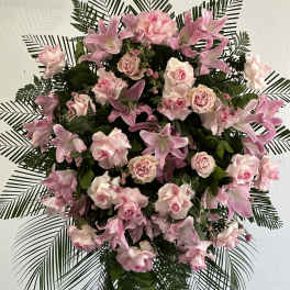 Pink floral standing spray with roses and lilies