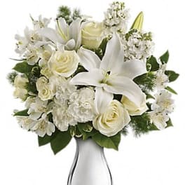 White floral bouquet in a silver vase