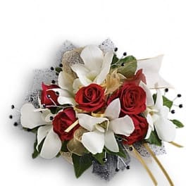 Red roses and white orchids in a compact bouquet