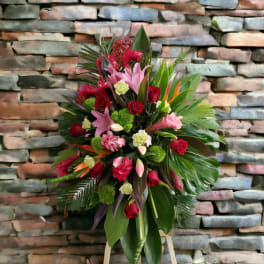 Standing floral spray with pink lilies and red roses