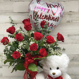 Red rose bouquet with a heart balloon, teddy bear, and chocolate box