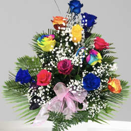 Colorful bouquet of roses with baby's breath in a white vase