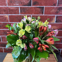 Mixed bouquet of alstroemeria in a glass vase