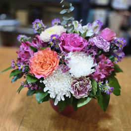 Mixed pink, white, and purple bouquet in a vase