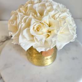 Cream rose bouquet in a gold vase