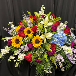 Large mixed bouquet with sunflowers, roses, lilies, hydrangea, and stock