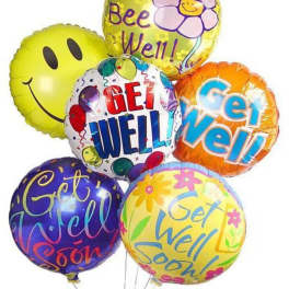 Cluster of colorful get-well balloons with smiley faces and floral graphics