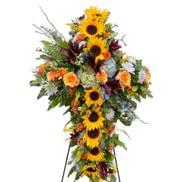 Standing floral spray with sunflowers, orange roses, and mixed blooms