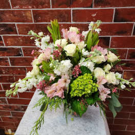 Bouquet of white roses, pink alstroemeria, and green hydrangea