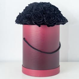Tall pink hatbox filled with a dome of black roses