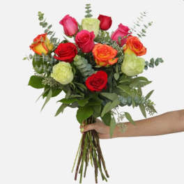 Handheld bouquet of multicolored roses with eucalyptus