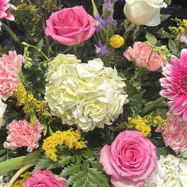 Mixed bouquet with pink roses, white hydrangea, and pink carnations