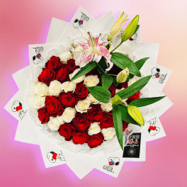 Bouquet of red and white roses with a pink lily