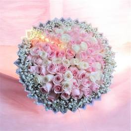 Large bouquet of pink and white roses with baby's breath