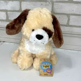Plush puppy toy with a tag attached