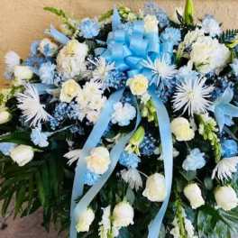 Baby blue & white sympathy casket Spray