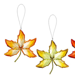 Four leaf-shaped crystal ornaments in orange and yellow tones
