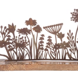 Metal flower silhouettes on a wooden base