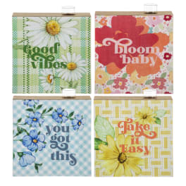 Four floral-themed decorative boxes with uplifting phrases and daisy prints