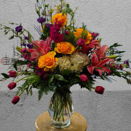 Colorful mixed bouquet in a clear glass vase