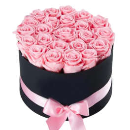 Pink roses arranged in a black round box with a pink ribbon bow