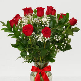 Dozen Red Rose's in a vase with baby breath
