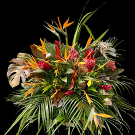 Tropical bouquet with orange bird-of-paradise and red flowers