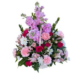 Basket arrangement of pink and purple flowers with white daisies and roses