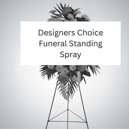 Designer's choice funeral standing spray on a tall metal easel with mixed flowers and foliage
