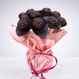 Bouquet of chocolate rose-shaped candies wrapped in pink paper