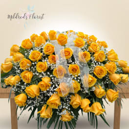 Large bouquet of yellow roses with white baby's breath and a sheer ribbon