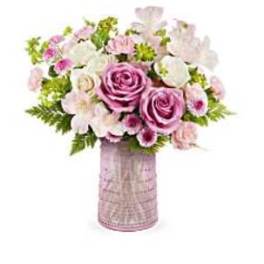 Pink and white flower bouquet in a tall vase