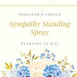 Sympathy standing spray with blue and cream flowers