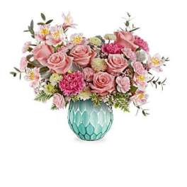 Pink rose bouquet in a turquoise glass vase