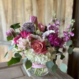 Pink and white mixed bouquet in a clear glass vase