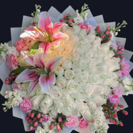 Large bouquet of white roses and pink lilies with pink accents