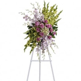 Tall floral spray with purple roses and lavender blooms on a stand