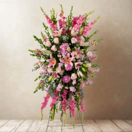 Tall pink floral standing spray with lilies and roses