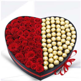 Heart-shaped box with red roses and gold-wrapped chocolates